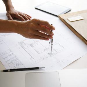 Engineering colleagues interior designer Corporate Achievement Planning Design on blueprint Teamwork Concept with compasses